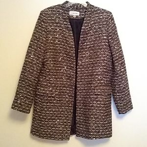 Calvin Klein longer style jacket. Has silver black and burgundy pattern.